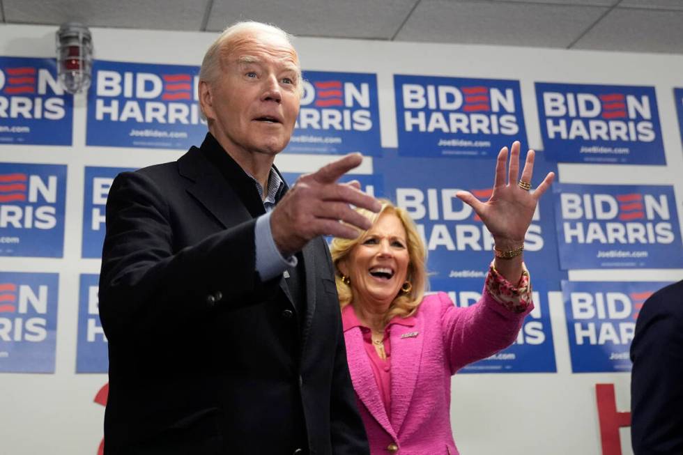 President Joe Biden, left, and first lady Jill Biden visit the Biden campaign headquarters in W ...