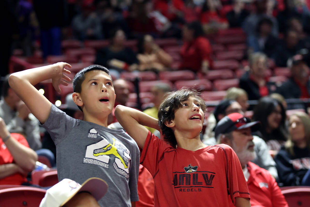 UNLV Rebels fans cheer for their team during the second half of an NCAA college basketball game ...
