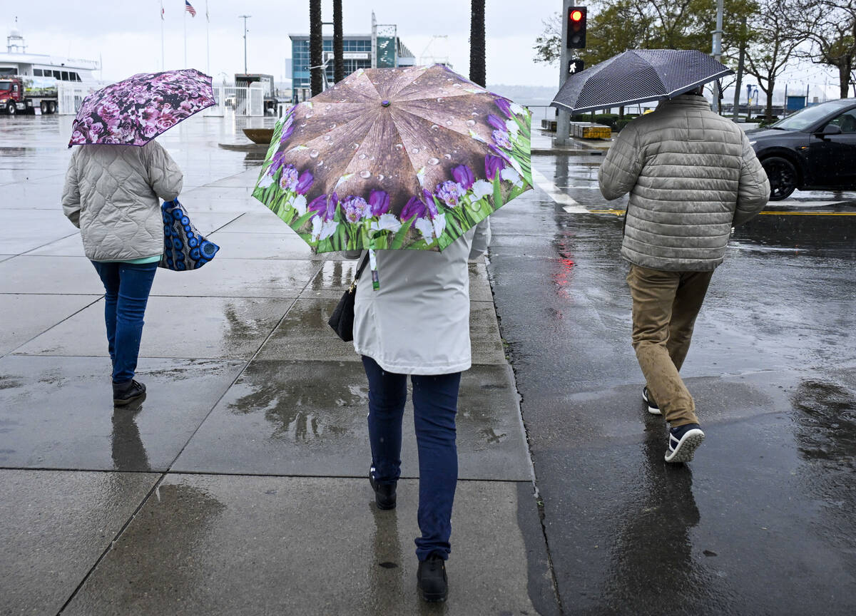 Tourists walk along the Embarcadero, Thursday, Feb. 1, 2024, in San Diego. The first of two bac ...