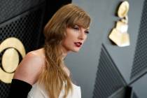 Taylor Swift arrives at the 66th annual Grammy Awards on Sunday, Feb. 4, 2024, in Los Angeles. ...