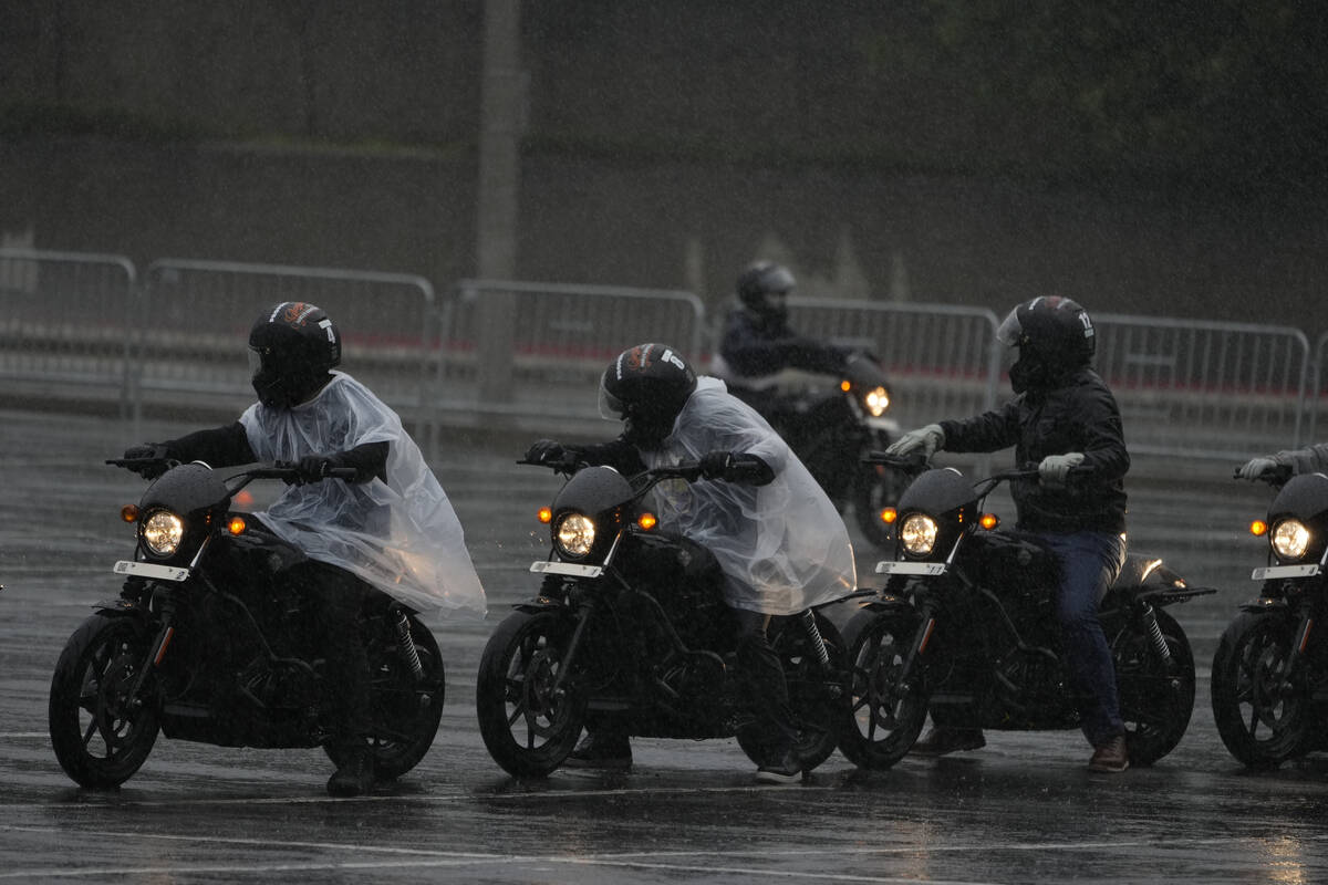 Riders line up under heavy rain during the California Motorcyclist Safety Program (CMSP) traini ...