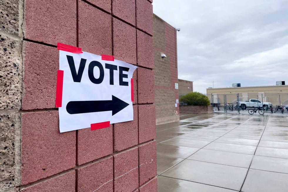 A sign directs primary voters at Bob Miller Middle School Tuesday, February 6, 2024, in Henders ...