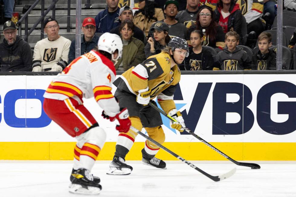 Golden Knights center William Karlsson (71) skates for the net against Flames defenseman Rasmus ...