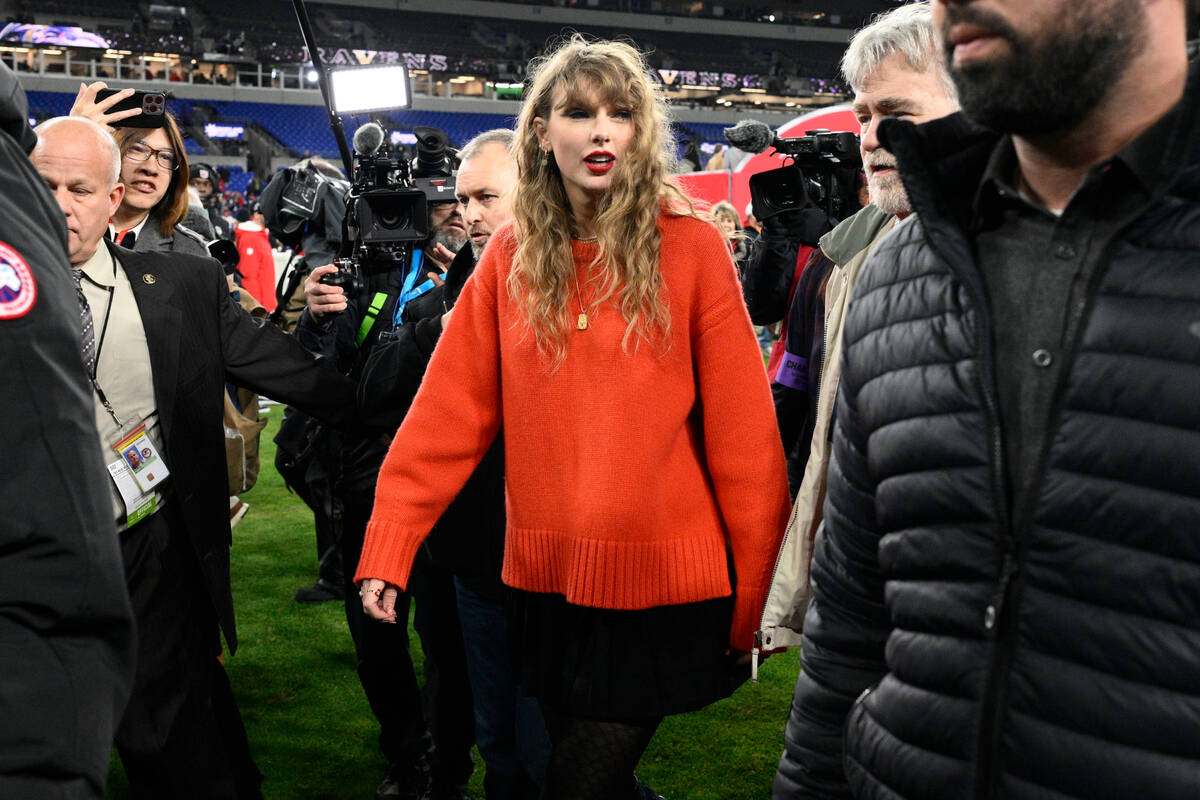 Taylor Swift walks on the field after the AFC Championship NFL football game between the Baltim ...