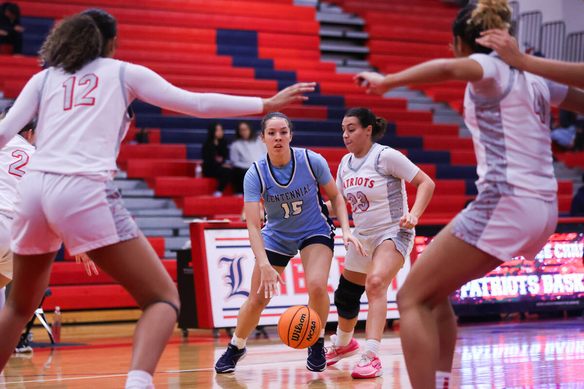Centennial’s Jada Price (15) is guarded by Liberty’s Xasia Smith (23) during a ba ...