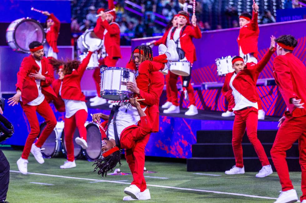 A drum group performs to warm up the crowd during the Super Bowl Opening Night celebration at A ...