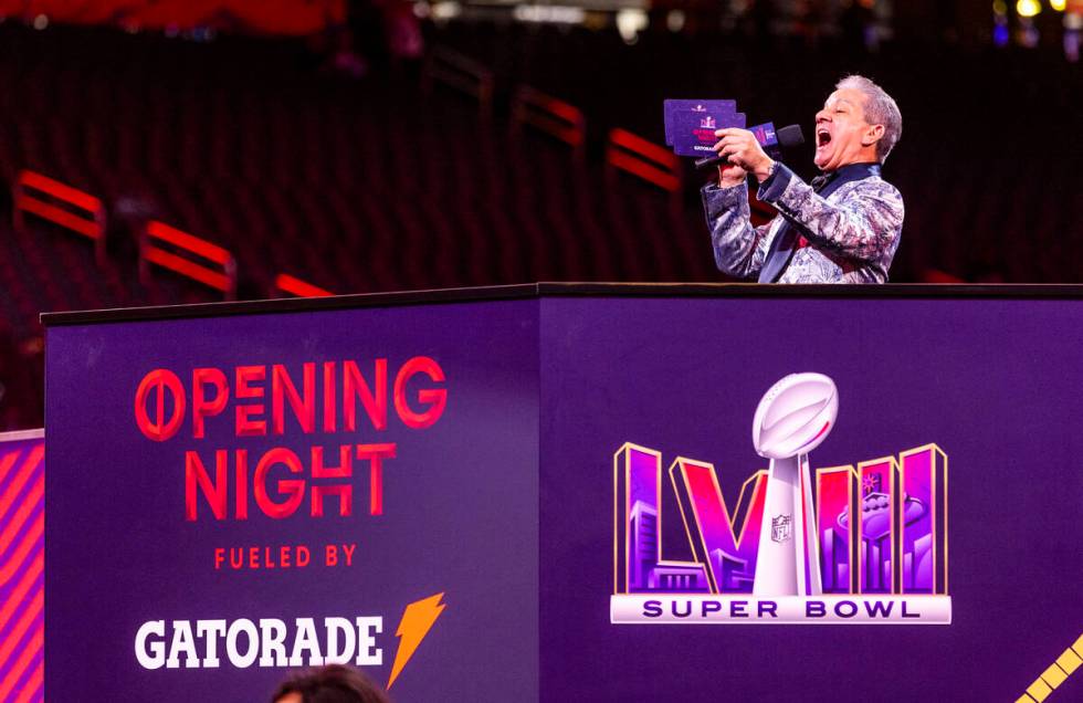 Announcer Bruce Buffer brings on the Kansas City Chiefs to the field during the Super Bowl Open ...