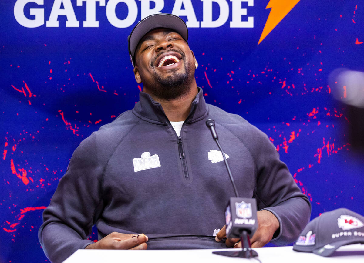 Kansas City Chiefs player Chris Jones laughs at a media member's question on the field during t ...