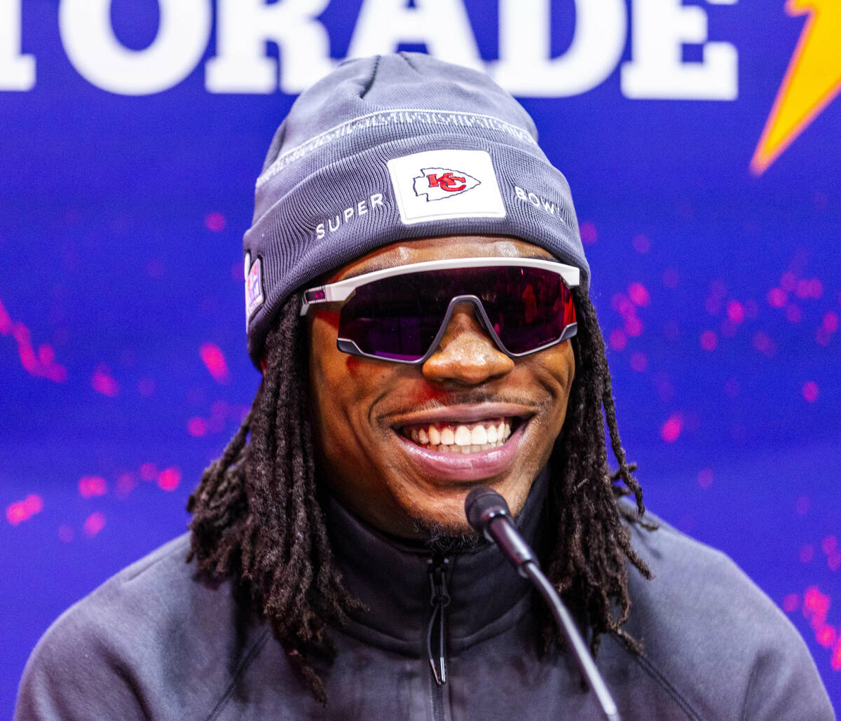 Kansas City Chiefs player Rashee Rice smiles at a media member's question on the field during t ...