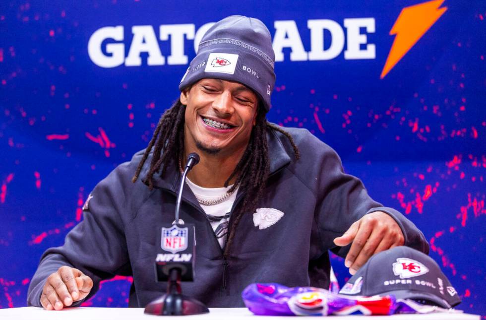 Kansas City Chiefs player Isiah Pacheco smiles at a media member's question on the field during ...