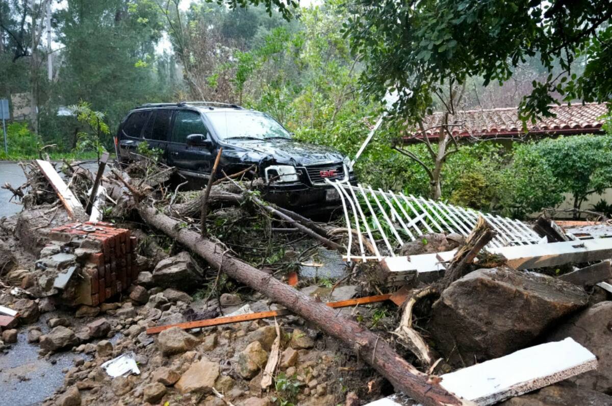 Mud, rocks and debris from a storm are strewn outside of a property Monday, Feb. 5, 2024, in St ...