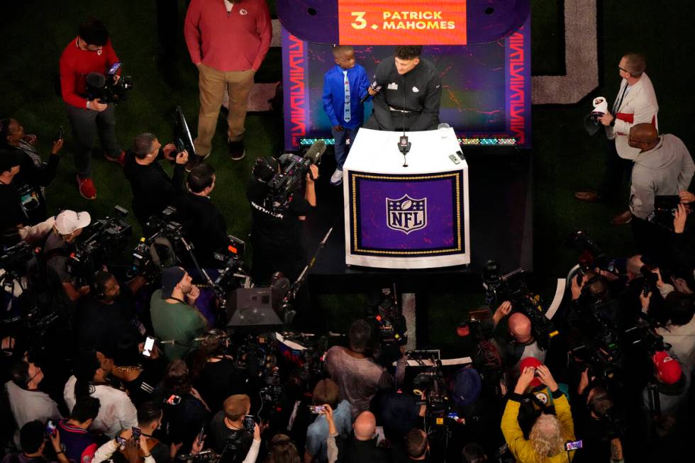 Kansas City Chiefs quarterback Patrick Mahomes, center, is interviewed during the NFL football ...