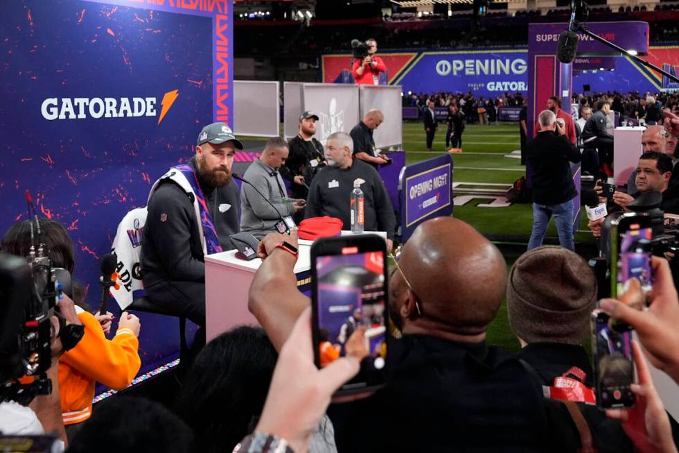 Kansas City Chiefs tight end Travis Kelce, left, participates in the NFL football Super Bowl 58 ...