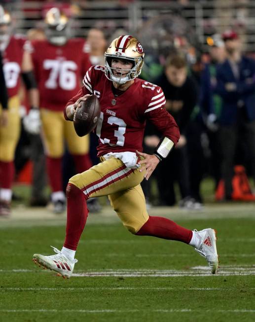 San Francisco 49ers quarterback Brock Purdy (13) runs up the field during the NFC Championship ...