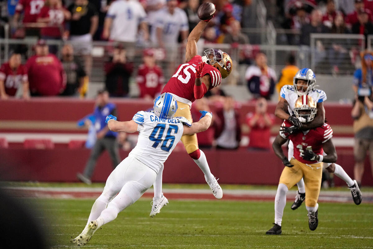San Francisco 49ers wide receiver Jauan Jennings (15) catches a pass against Detroit Lions line ...