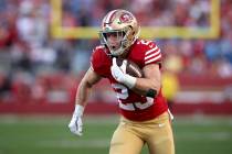 San Francisco 49ers running back Christian McCaffrey (23) runs during the NFC Championship NFL ...