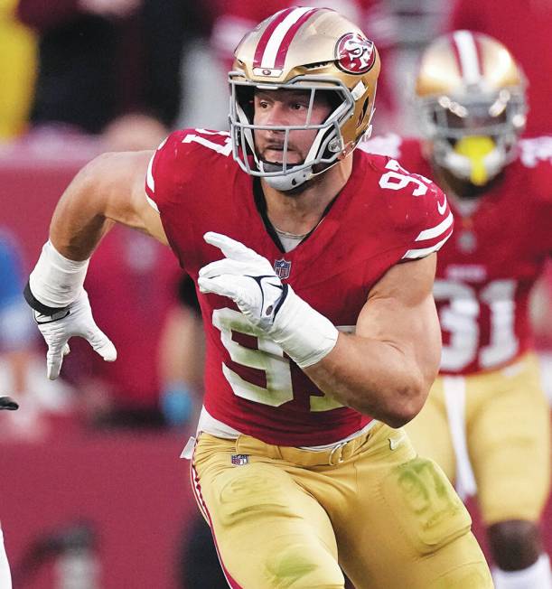 San Francisco 49ers defensive end Nick Bosa rushes toward the ball during the first half of the ...