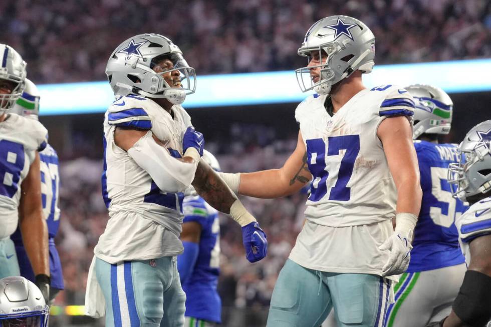 Dallas Cowboys running back Tony Pollard (20) pounds his chest after his rushing touchdown as h ...