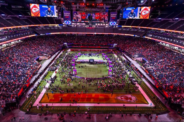 Fans, guests and media members fill the stands and field as Kansas City Chiefs players and coac ...