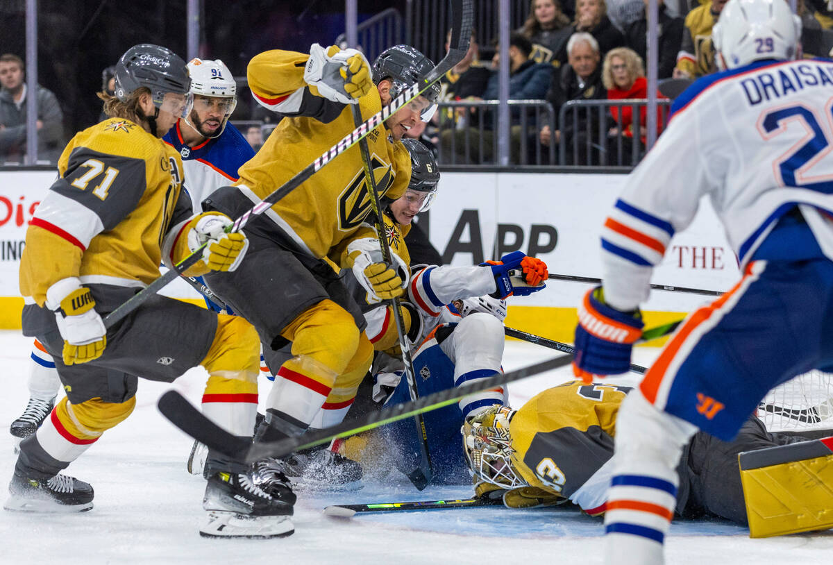 Golden Knights goaltender Adin Hill (33) smothers a shot on goal by Edmonton Oilers left wing A ...