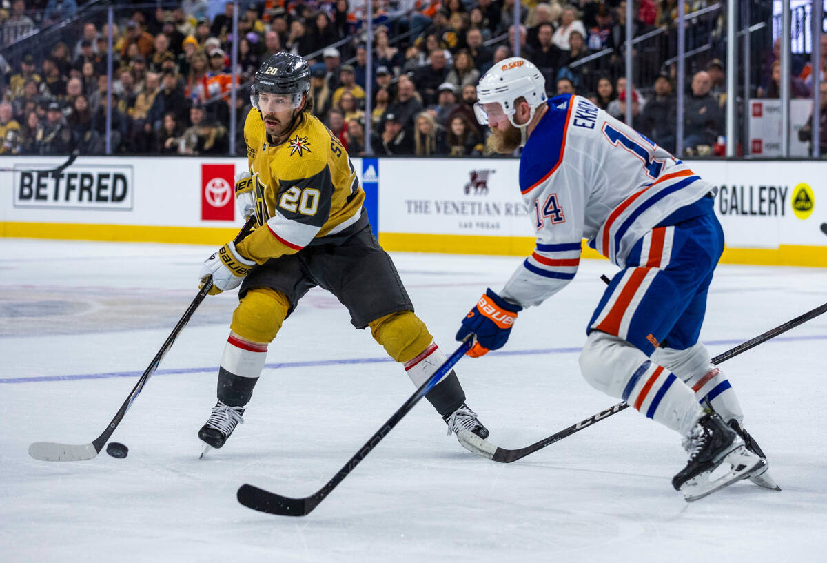 Golden Knights center Chandler Stephenson (20) controls the puck against Edmonton Oilers defens ...