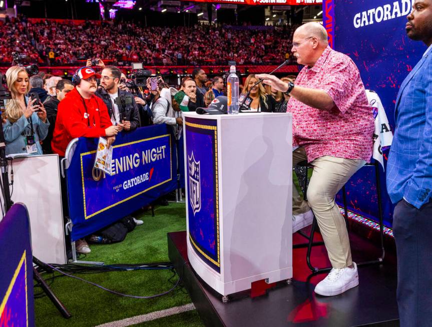 Kansas City Chiefs Head Coach Andy Reid answers a media member's question on the field during t ...