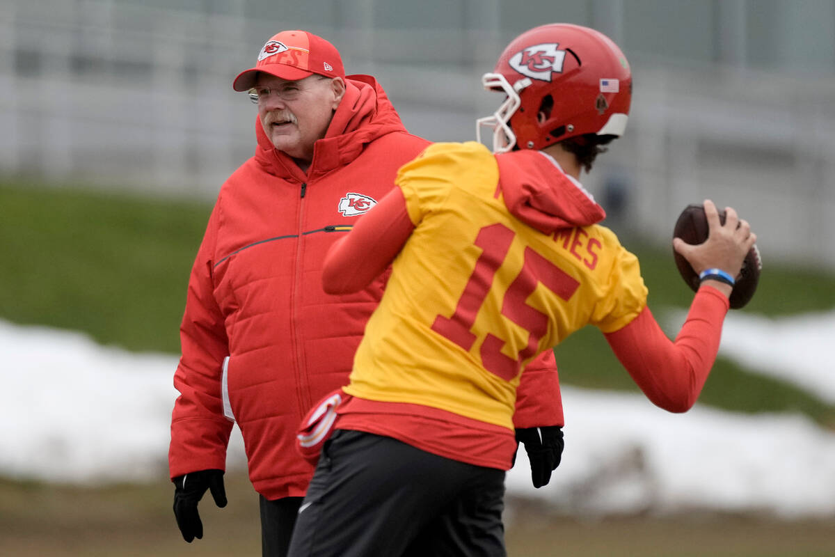 Kansas City Chiefs head coach Andy Reid watches while quarterback Patrick Mahomes throws during ...
