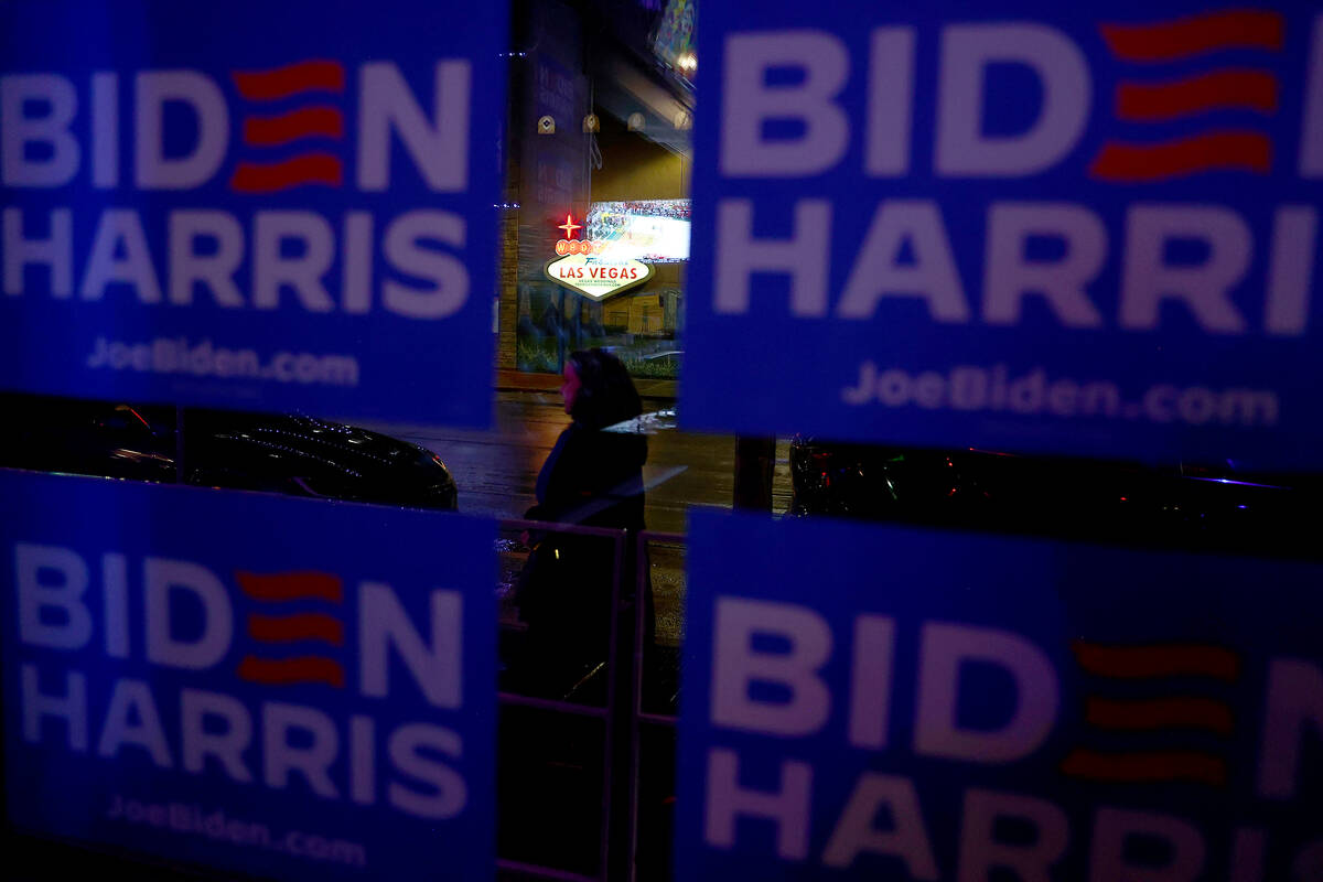 Biden-Harris campaign signs adorn the windows of the Classic Jewel during a celebration after p ...