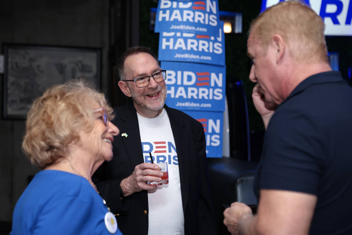 Margy Feldman, left, Richard Gilroy and Steve Lane chat during a celebration for Nevada Democra ...