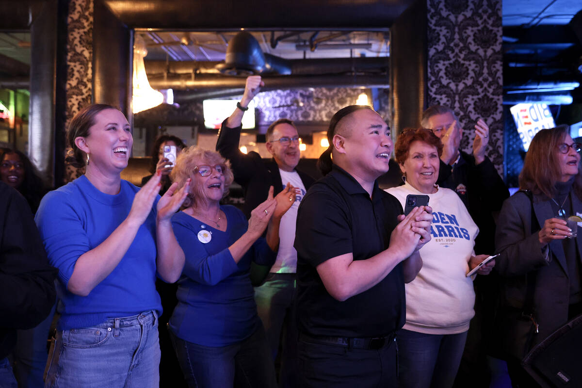 Democrats cheer while Nevada Attorney General Aaron Ford speaks during a celebration after poll ...