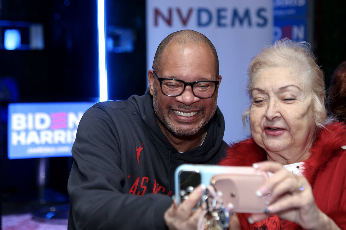 Nevada Attorney General Aaron Ford poses for a selfie with Democrat Honey Borla during a celebr ...
