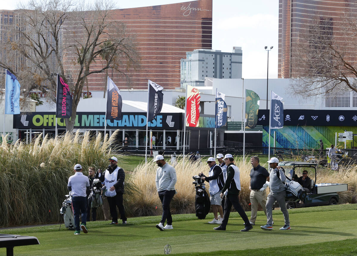 Players, including Jon Rahm, center, prepare to compete in LIV Golf Las Vegas Pro-Am tournament ...