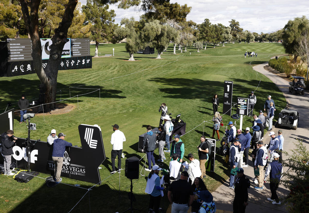 Players and their caddies gather at Las Vegas Country Club during LIV Golf Las Vegas Pro-Am tou ...