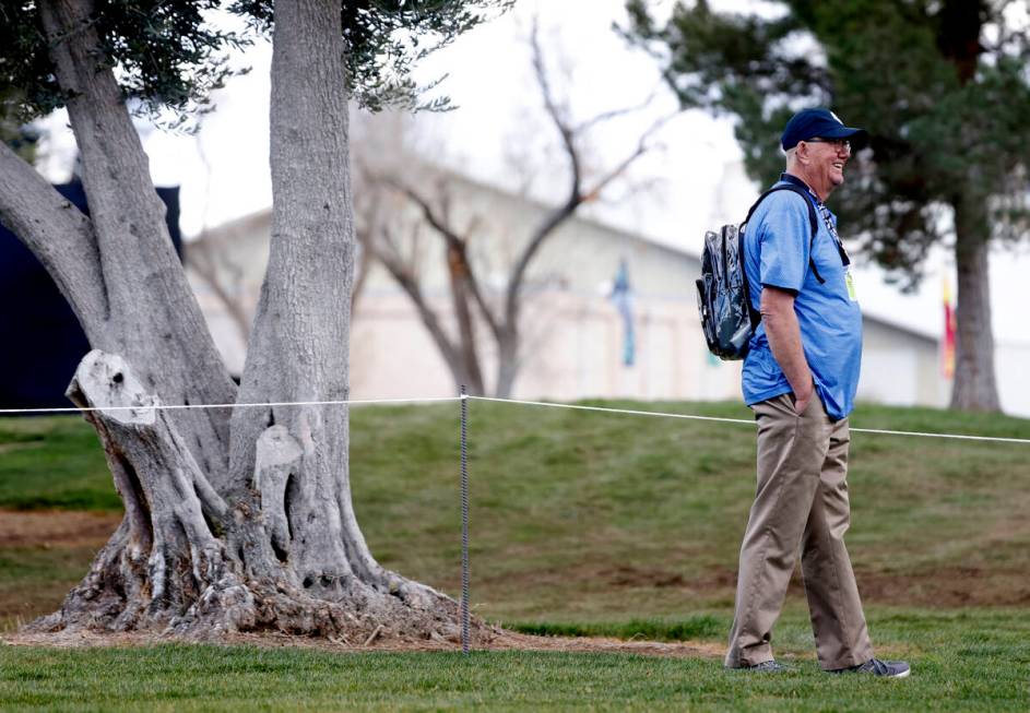 A fan watches LIV Golf Las Vegas Pro-Am tournament at Las Vegas Country Club, on Wednesday, Feb ...