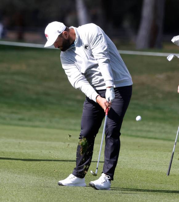 Jon Rahm hits onto the 18th green during LIV Golf Las Vegas Pro-Am tournament at Las Vegas Coun ...