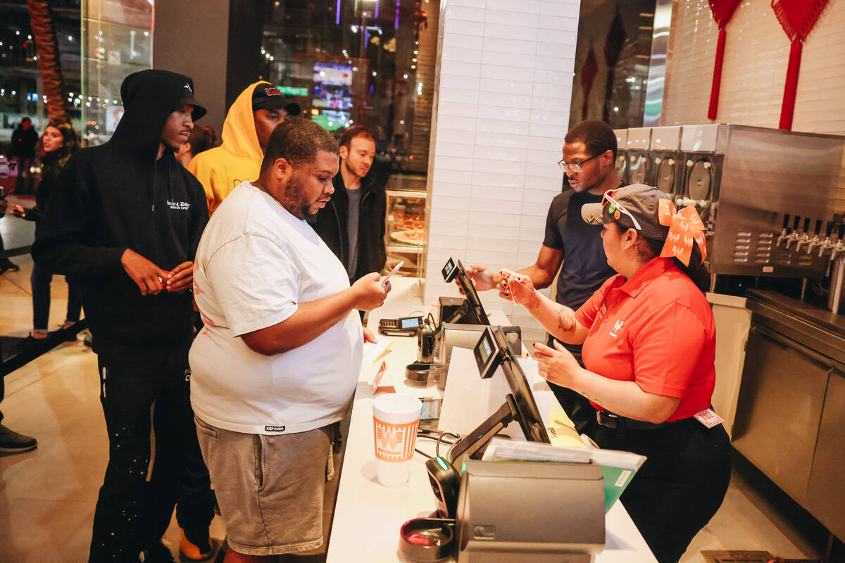 Customers order at Whataburger on Wednesday, Feb. 7, 2024, in Las Vegas. (Madeline Carter/Las V ...