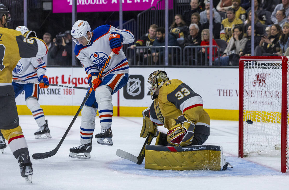 Edmonton Oilers left wing Zach Hyman (18) sends a shot past Golden Knights goaltender Adin Hill ...