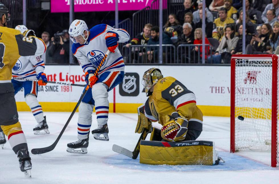 Edmonton Oilers left wing Zach Hyman (18) sends a shot past Golden Knights goaltender Adin Hill ...