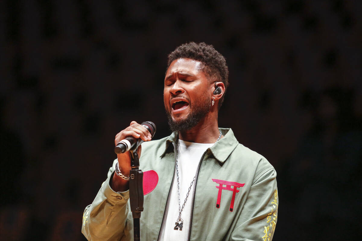 Singer Usher sings during a rehersal to honor the late Kobe Bryant prior to an NBA game against ...