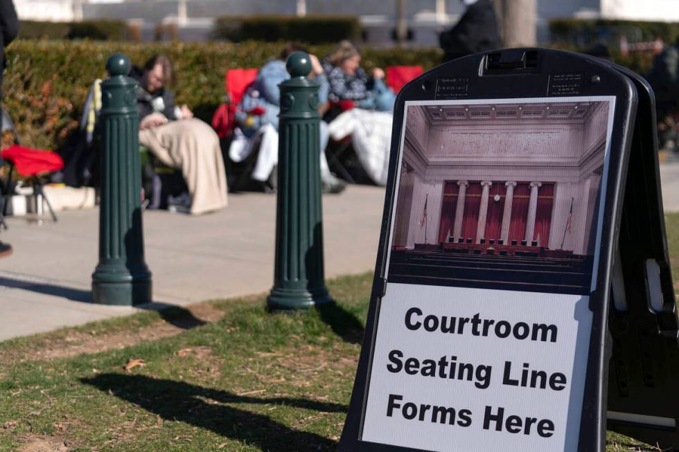 People wait in line outside of the U.S. Supreme Court Wednesday, Feb. 7, 2024, in Washington, t ...