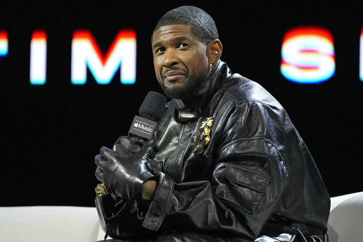 Usher speaks during a news conference ahead of the Super Bowl 58 NFL football game Thursday, Fe ...