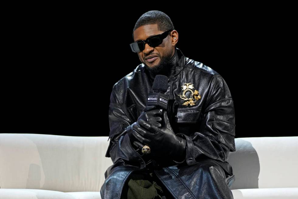 Usher speaks during a news conference ahead of the Super Bowl 58 NFL football game Thursday, Fe ...