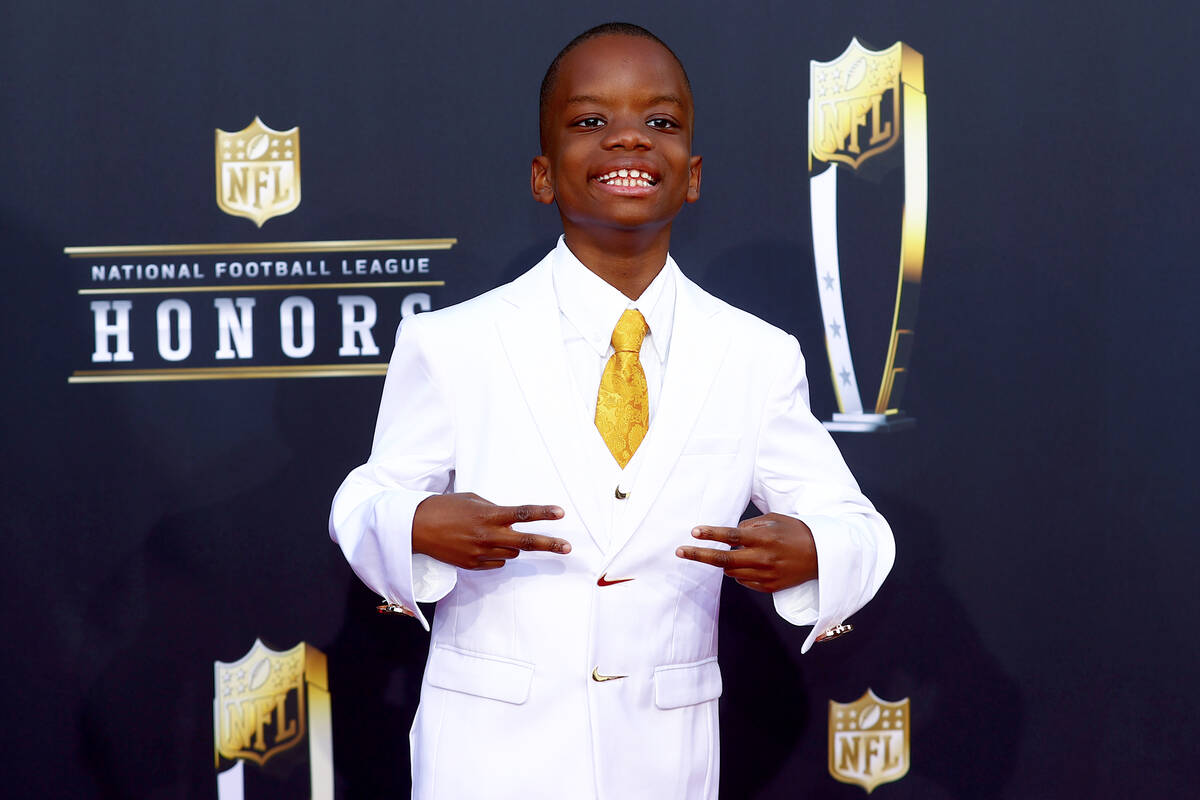 Jeremiah Fennell, 11, of Las Vegas, poses on the red carpet before the annual NFL Honors awards ...