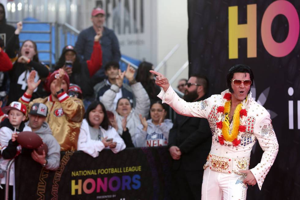An Elvis impersonator pumps up fans on the red carpet before the annual NFL Honors awards show ...