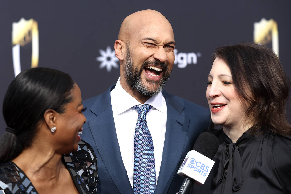 Keegan Michael-Key, host of the show, laughs while speaking to reporters next to his wife, Elle ...