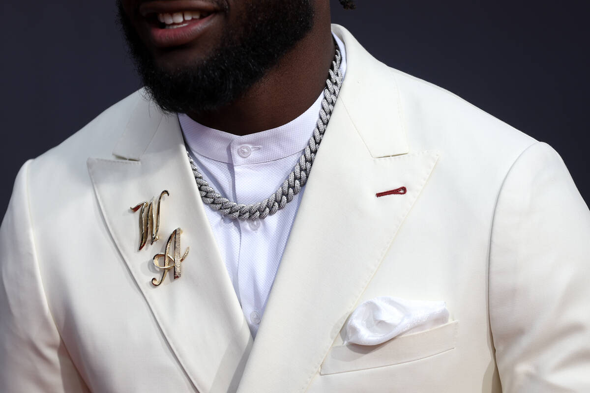 Will Anderson of the Houston Texans wears his initials as pins on the red carpet before the ann ...