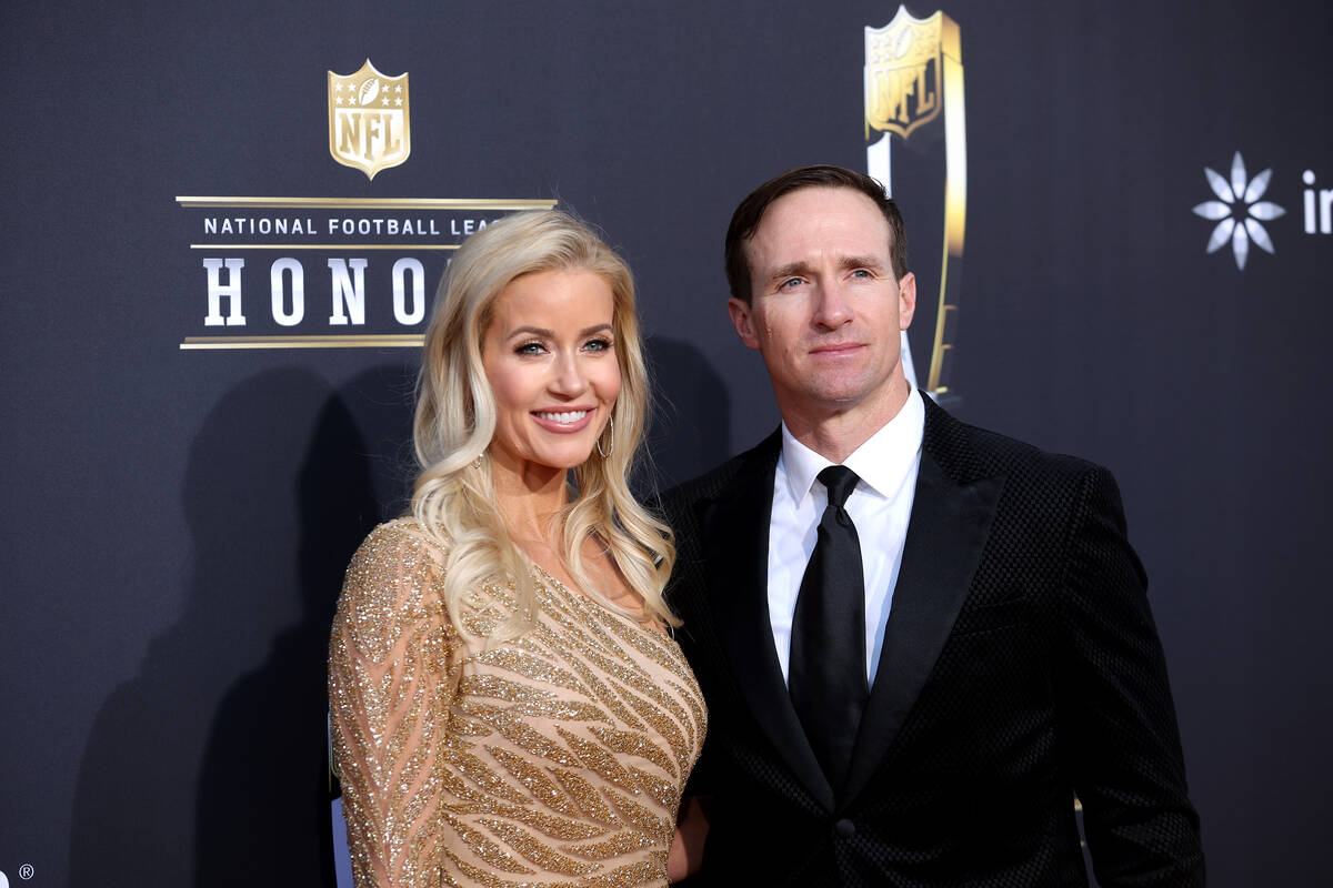Former NFL quarterback Drew Brees and wife Brittany Brees walk on the red carpet before the ann ...