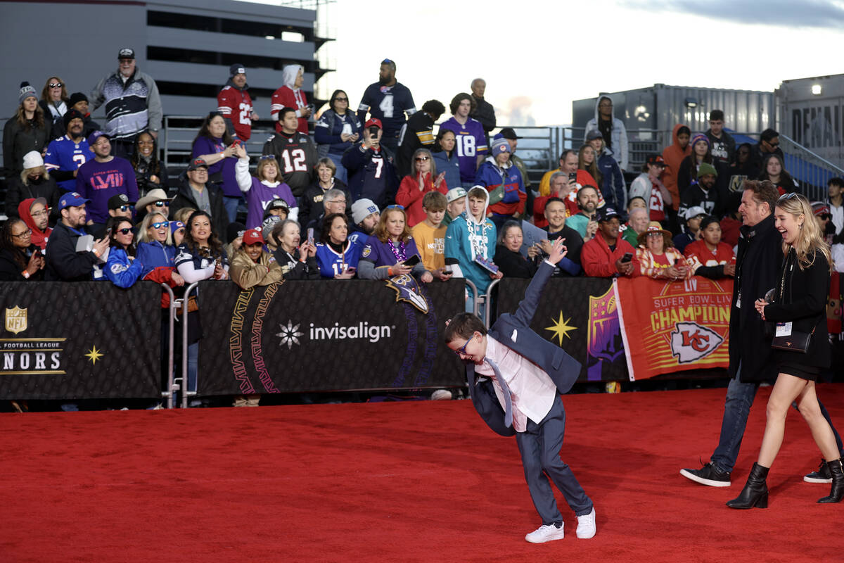 A young attendee dances on the red carpet before the annual NFL Honors awards show at Resorts W ...