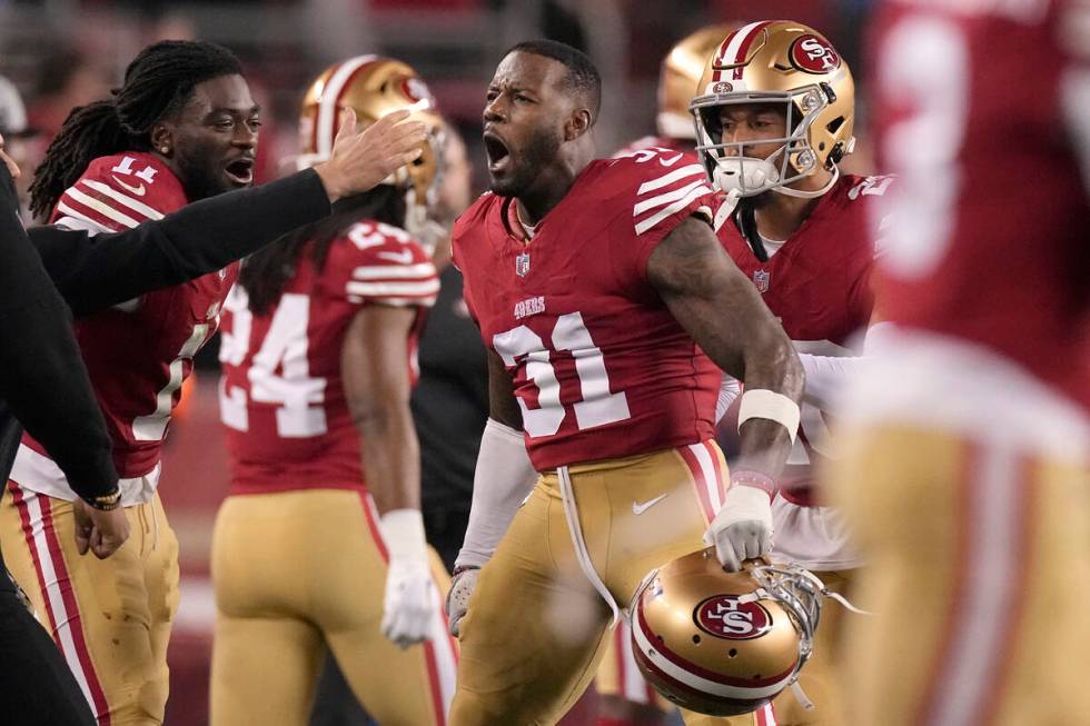 San Francisco 49ers wide receiver Brandon Aiyuk, left, and safety Tashaun Gipson Sr. (31) celeb ...