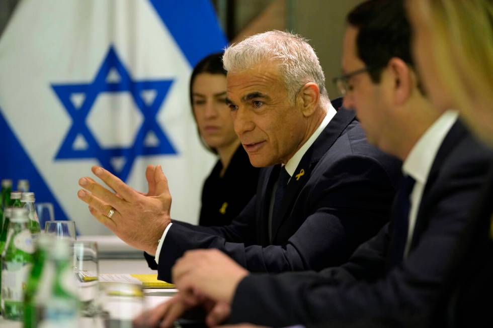 Israeli opposition leader Yair Lapid, centre left, meets with U.S. Secretary of State Antony Bl ...